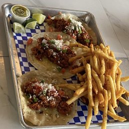 FireHouse Gastro Park signature dishes The Hook & Ladder Burger, Smoked Brisket Tacos, Loaded Mac & Cheese, Artisan Pizzas
